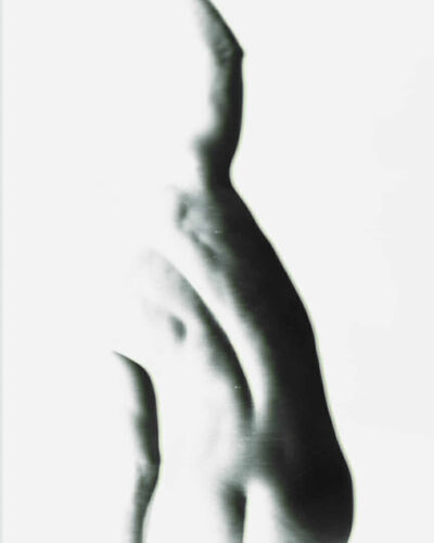 Black and white image of a human torso with an abstract shape and smooth contours.