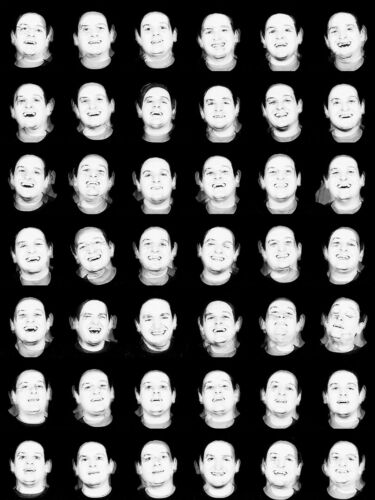 A grid of multiple black and white images of a person smiling, arranged in a uniform pattern.