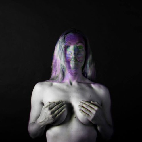 Black and white artistic portrait of a woman with abstract color effects on her face and body.