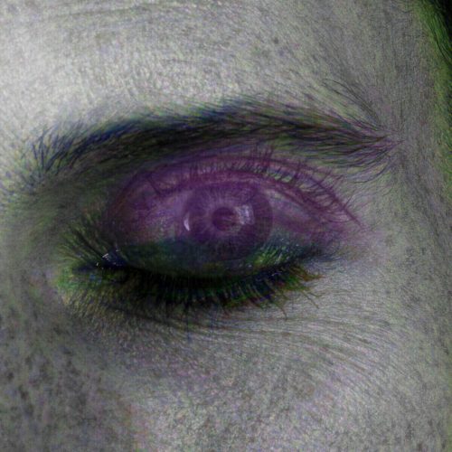 Close-up image of a human eye with abstract purple and green color effects applied.