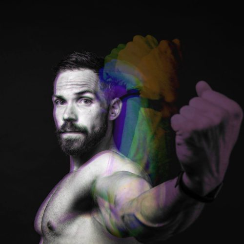 A man flexing his bicep with a motion blur effect showing multiple arm positions.