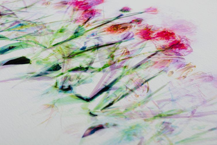 Abstract artwork featuring colorful floral patterns with pink and green hues on textured paper.